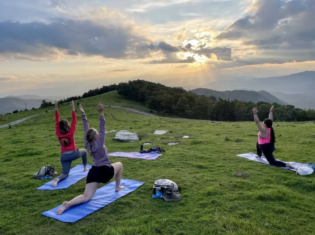 Hike to a sunset yoga practice on a mountaintop