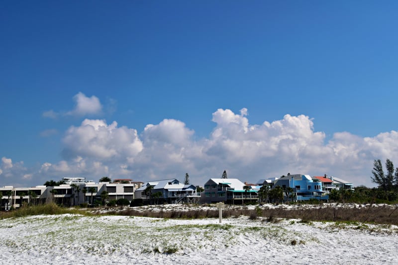 A serene yet lively beach town feel can be found on Siesta Key, one of the best places to live in Florida Gulf Coast.