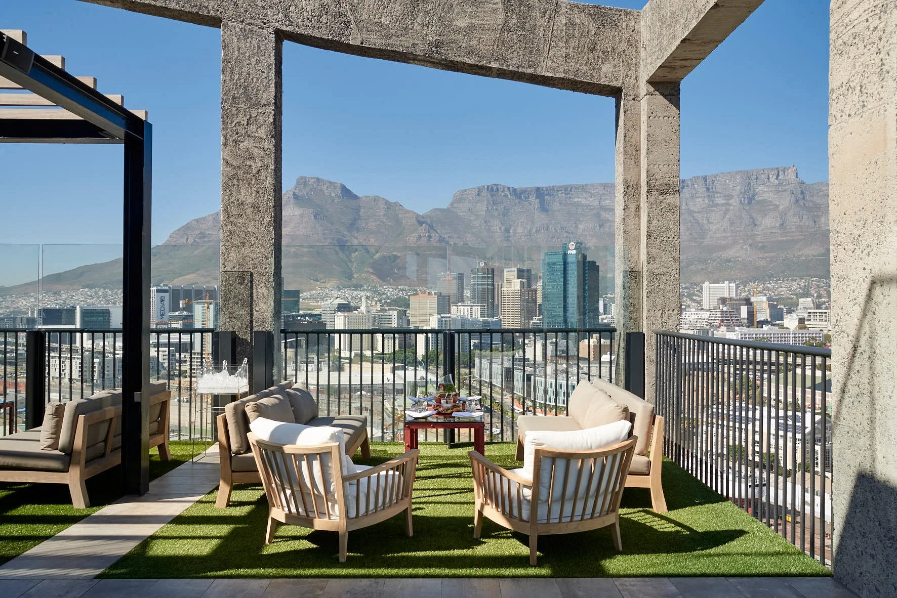 Silo Rooftop Bar terrace seating with panoramic Table Mountain and Cape Town city skyline views, one of the top things to do in Cape Town for young adults