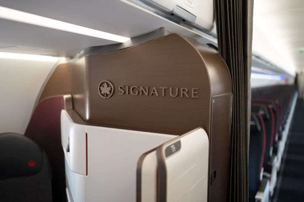 An Air Canada Signature Class suite partition inside an airplane cabin