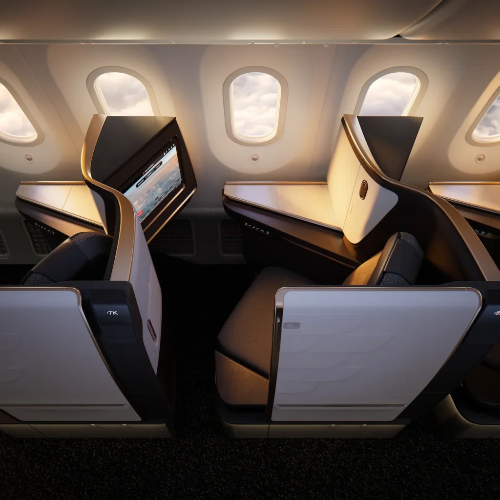 Air Canada Signature Class business seats next to windows inside a Boeing 787