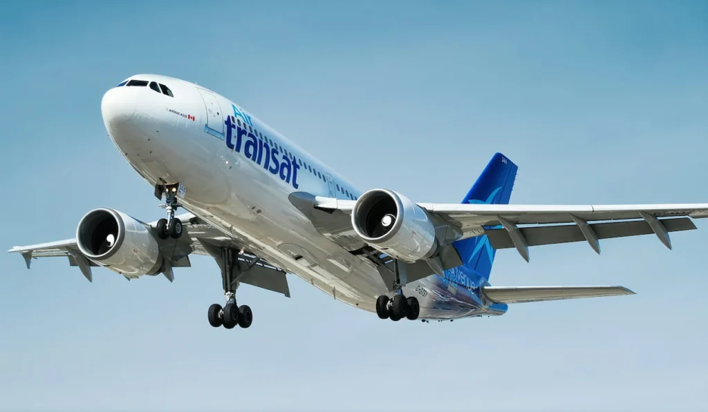 Air Transat Airbus A330 passenger airplane climbing into the sky during takeoff