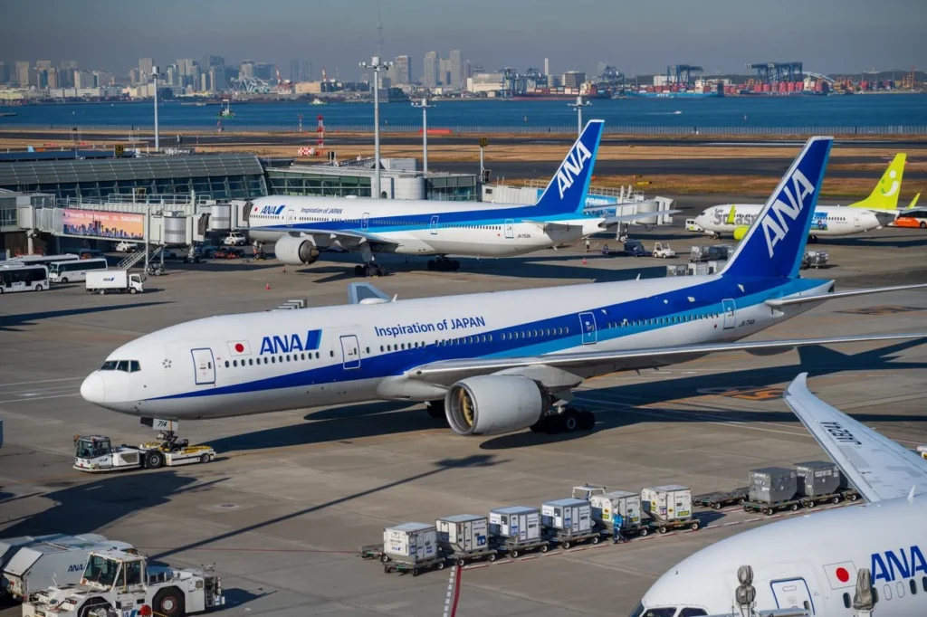ANA Boeing 777 aircraft parked at airport terminal gates