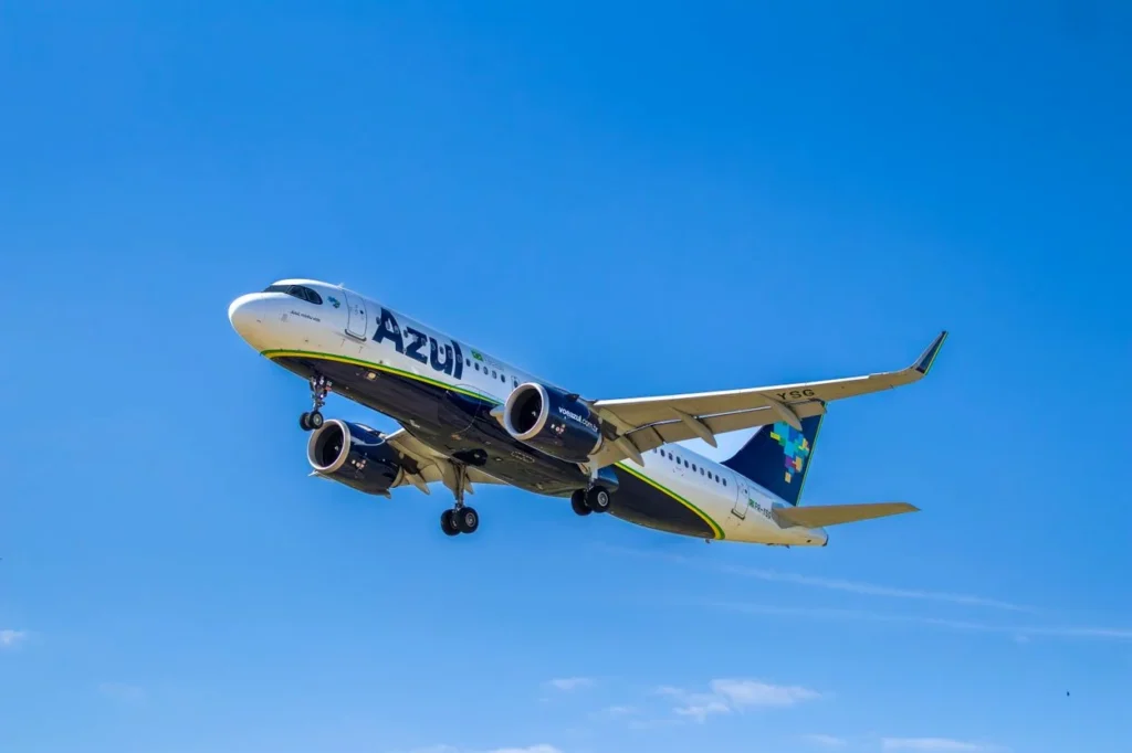 Azul Brazilian Airlines Airbus A320neo airplane climbing into a bright blue sky