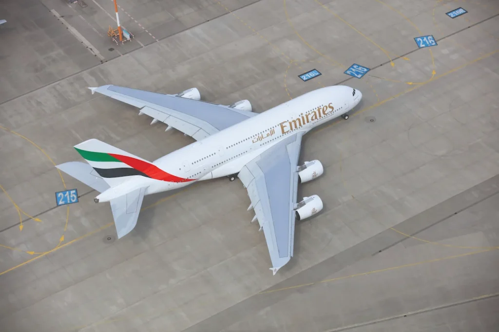 Aerial view of an Emirates Airbus A380 parked on an airport tarmac