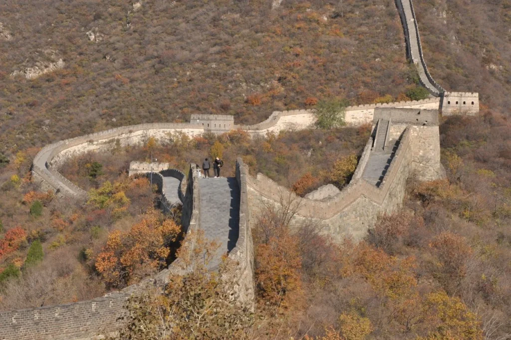 High-angle view of the Great Wall of China winding along autumn hills