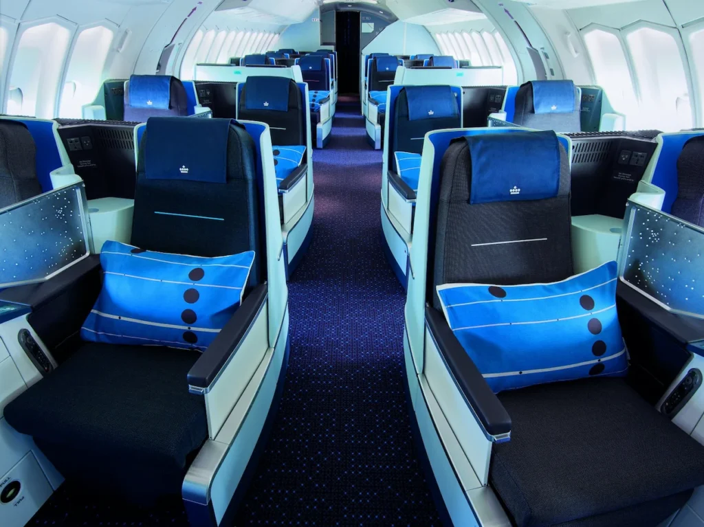 KLM business class cabin seats with signature blue pillows