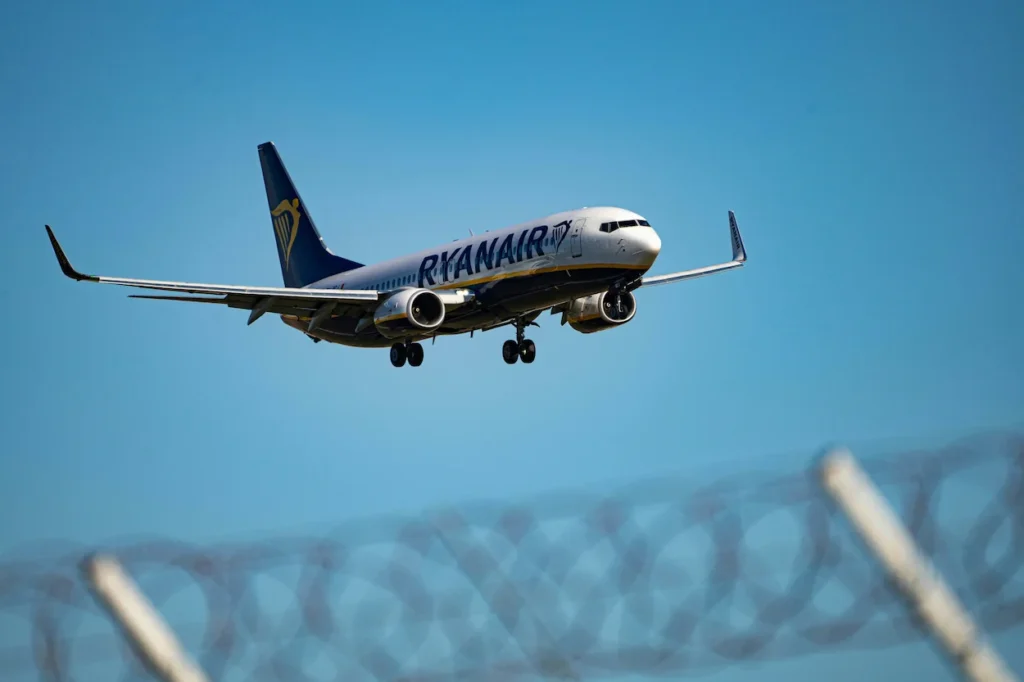 A Ryanair Boeing 737-800 commercial passenger airplane landing on a runway