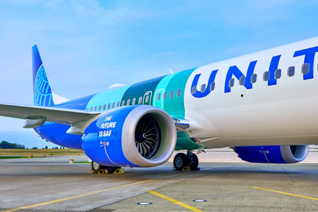 Close-up view of a green and blue United Airlines plane engine reading "The Future is SAF