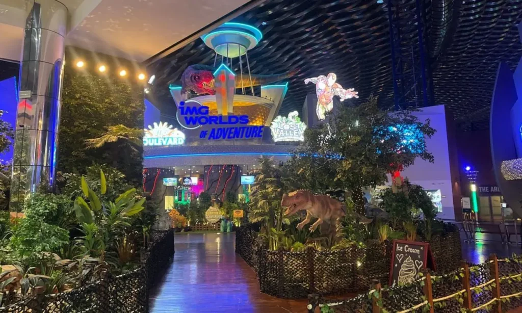The entrance to IMG Worlds of Adventure with colorful lights and themed decorations.