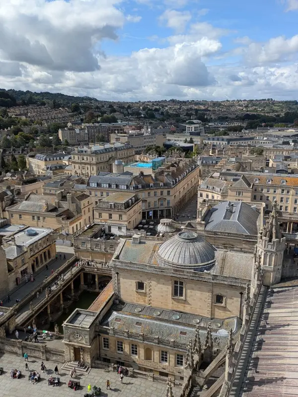 Aerial view of Bath city with Bath Abbey and historic buildings.