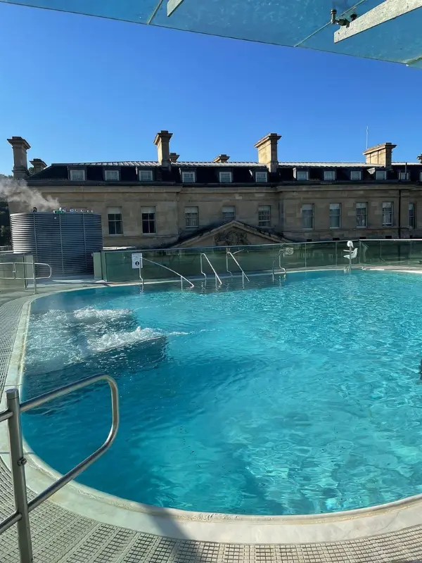 Rooftop pool with steaming water at Thermae Bath Spa.