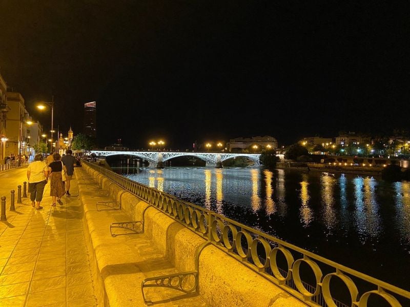 Calle Betis epitomizes Seville's nightlife, offering a vibrant atmosphere filled with bars, restaurants, and entertainment options for all.