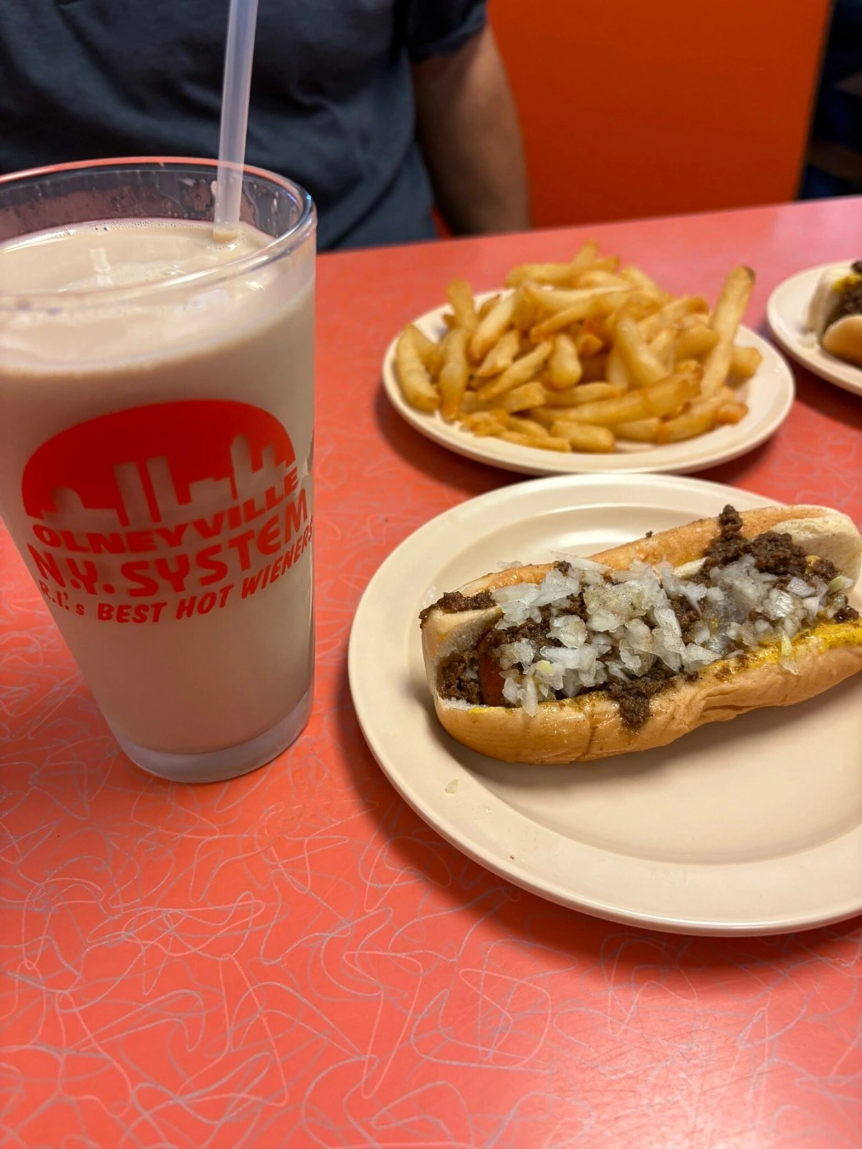 A hot weiner, fries, and a coffee milk at Olneyville New York System in Rhode Island