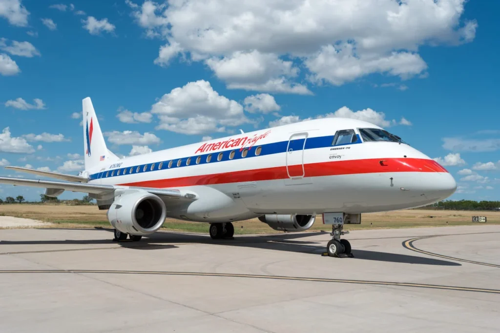 An American Eagle Embraer 170 regional jet operated by Envoy Air parked on an airport tarmac
