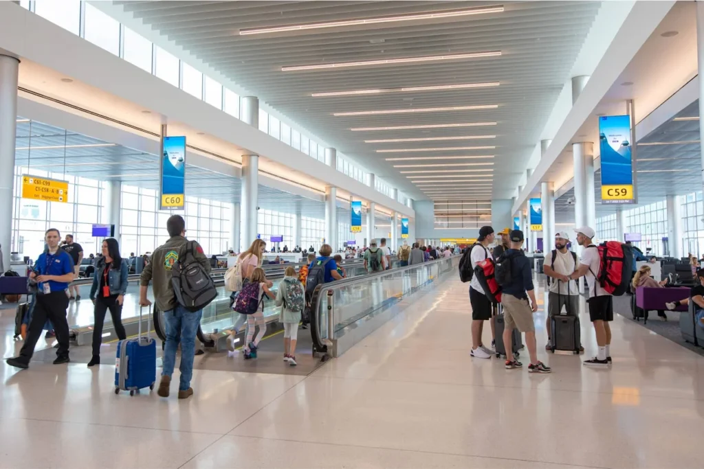 Passengers in the modern Concourse C of Denver International Airport