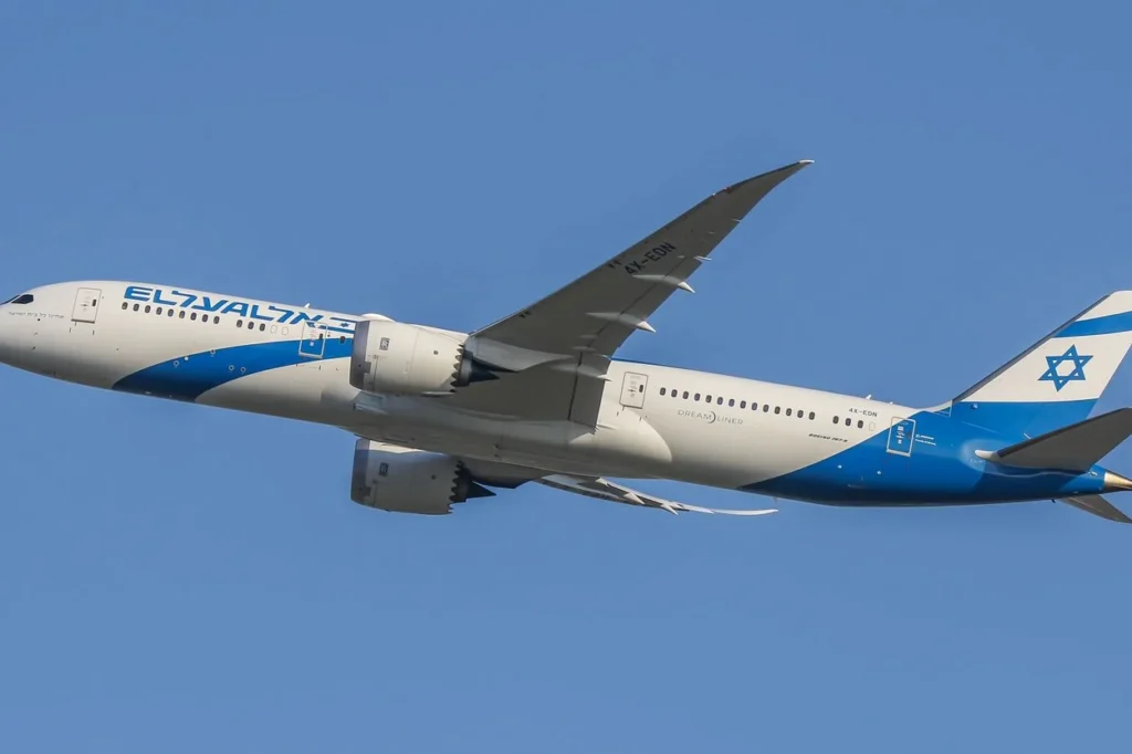 An El Al Boeing 787 Dreamliner airplane with registration 4X-EDN flying in a clear blue sky
