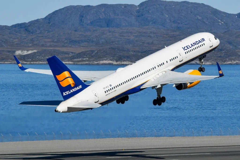 An Icelandair Boeing 757 passenger airplane taking off from a runway
