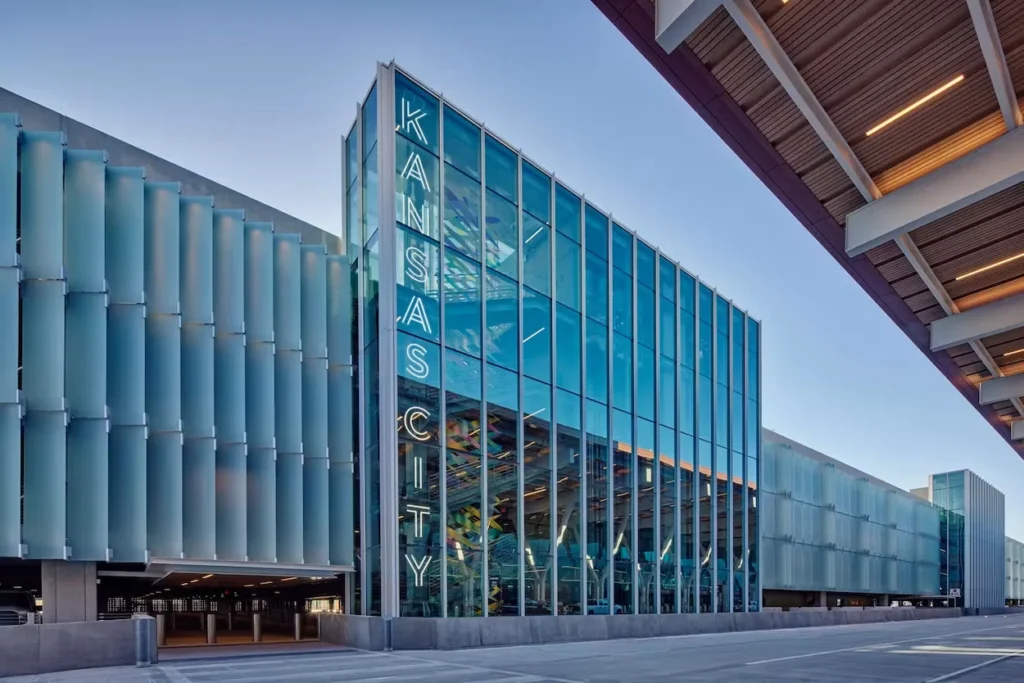 The glass airport parking garage with a neon Kansas City sign