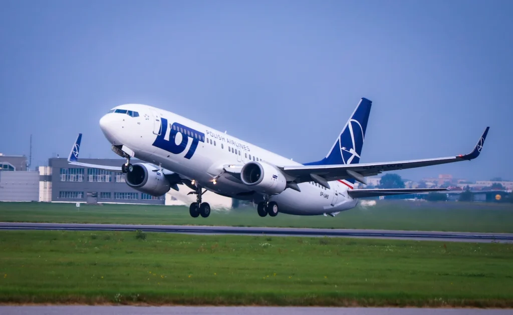 LOT Polish Airlines Boeing 737 passenger airplane lifting off from a runway