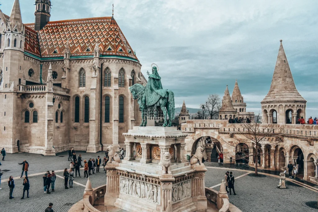 Matthias Church next to the white stone stone towers of Fisherman's Bastion