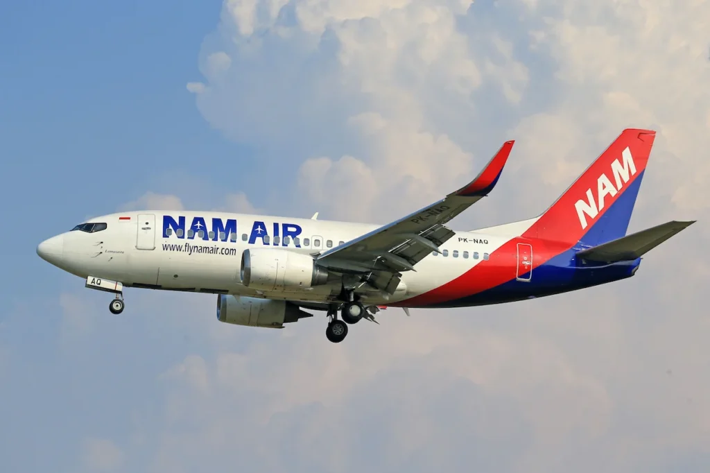 NAM Air Boeing 737 airplane descending for landing