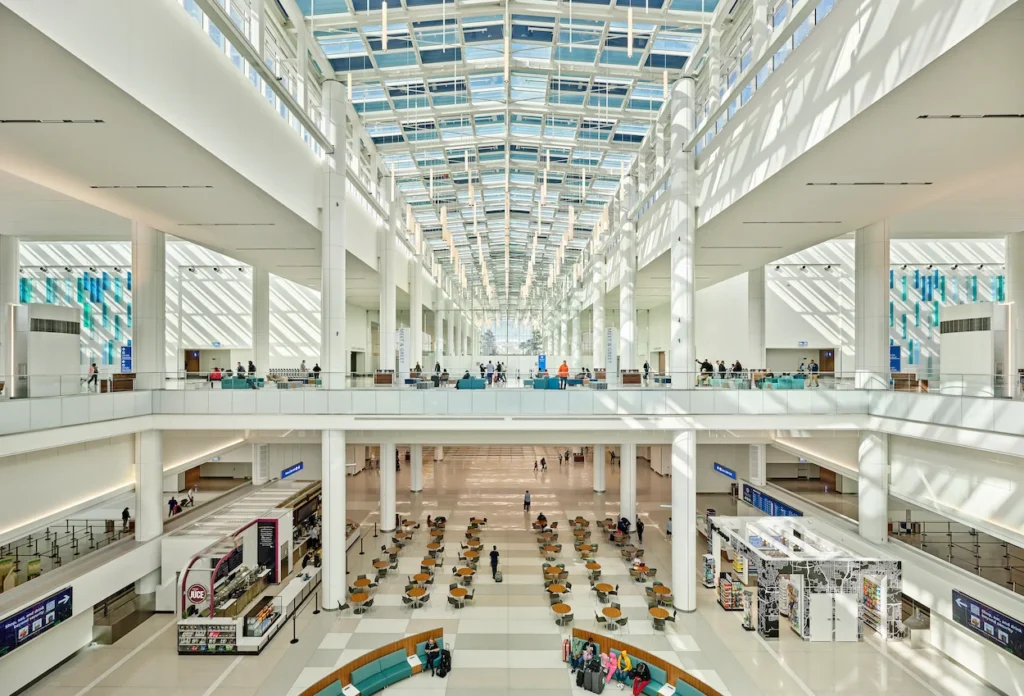 The multi-level atrium and skylit dining terrace inside MCO Airport Terminal C