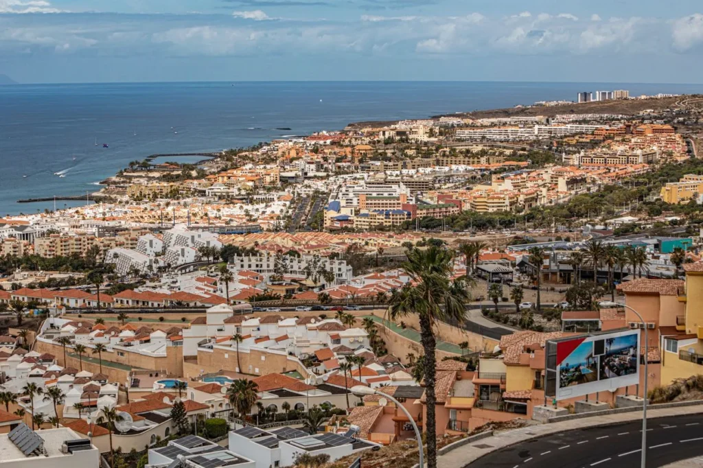 High-angle view of Playa de las Américas coastal town and the ocean in Tenerife