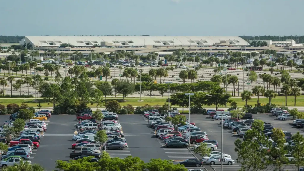 Terminal building and large outdoor parking lots at RSW Airport