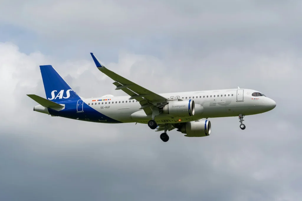 SAS Scandinavian Airlines Airbus A320neo landing with its landing gear down