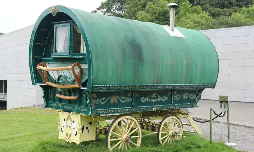 A traditional green wagon is displayed outside the National Museum of Ireland – Country Life.
