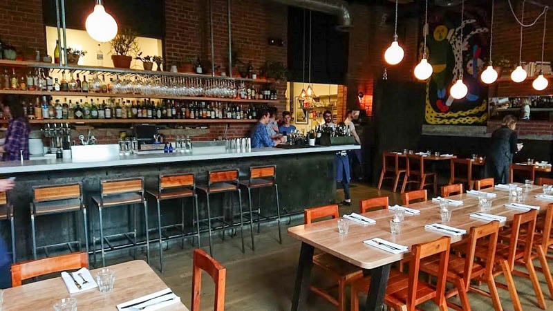 Experience a fresh twist on dining at Rolf and Daughters, offering a cozy industrial-chic vibe.
