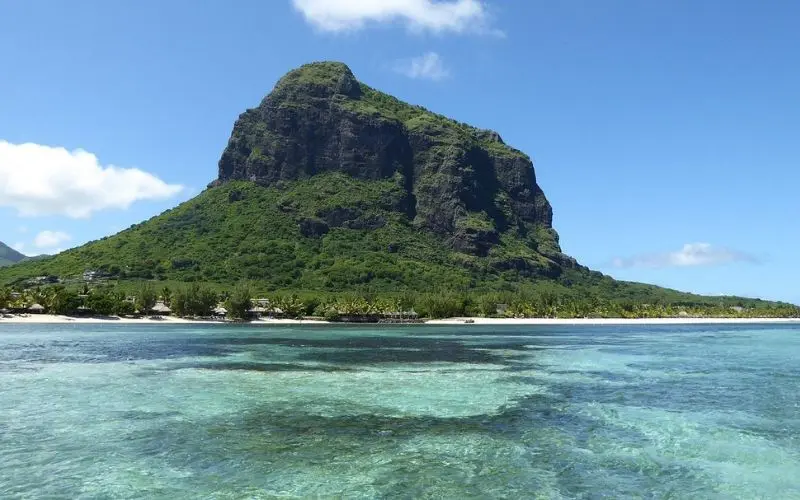 Le Morne Brabant mountain rising above the turquoise water in Mauritius.