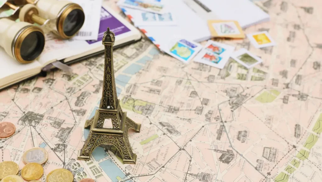 Travel essentials with a miniature Eiffel Tower from Paris