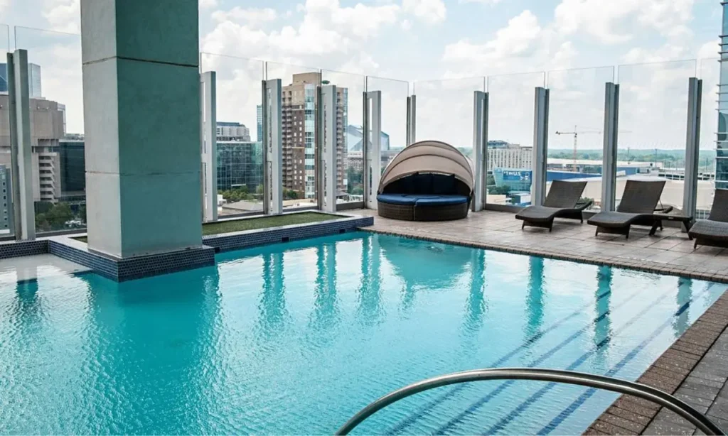 Rooftop pool with city views and lounge chairs at W Atlanta – Downtown.