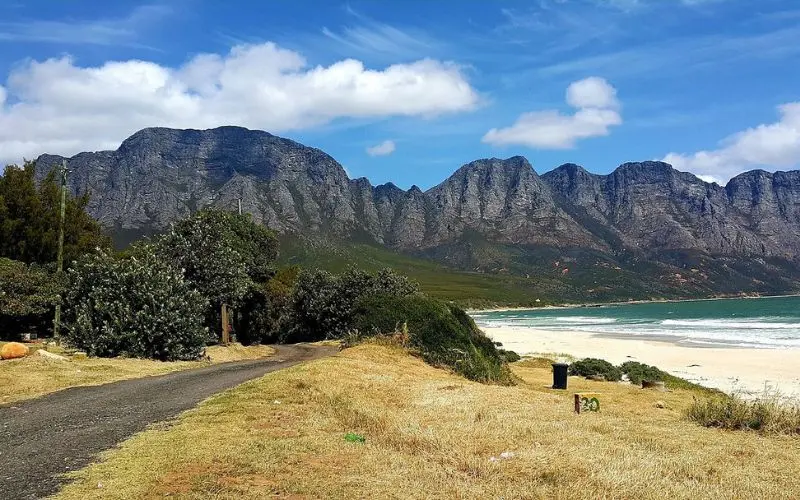 A scenic coastal view of mountains and beach in South Africa.