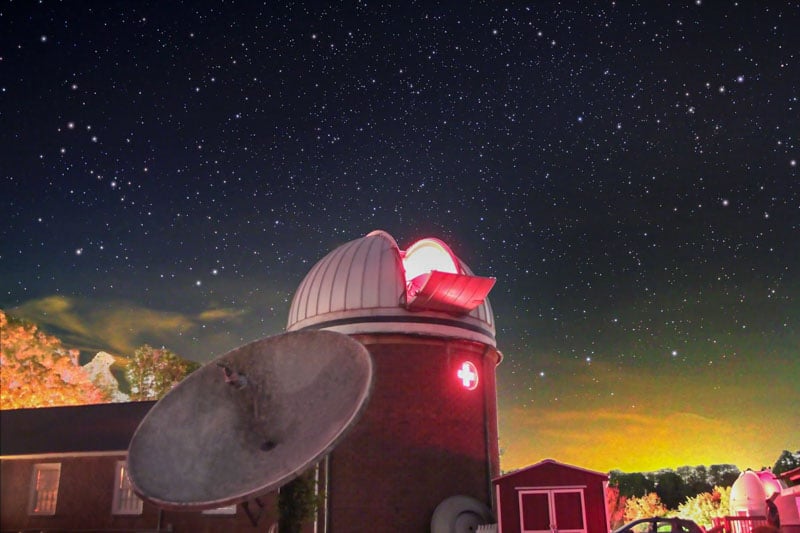 Image of Custer Observatory beneath a star-filled night sky