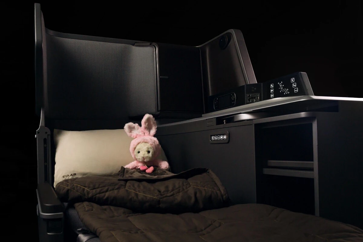 EVA Air business class lie flat bed with pillow and bedding on the 787