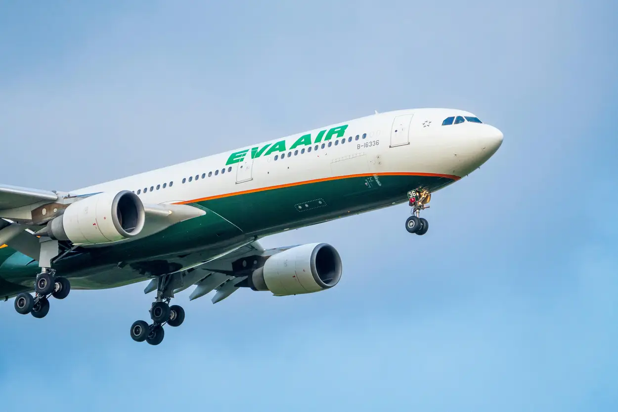 EVA Air aircraft on approach showing the airline's signature green livery