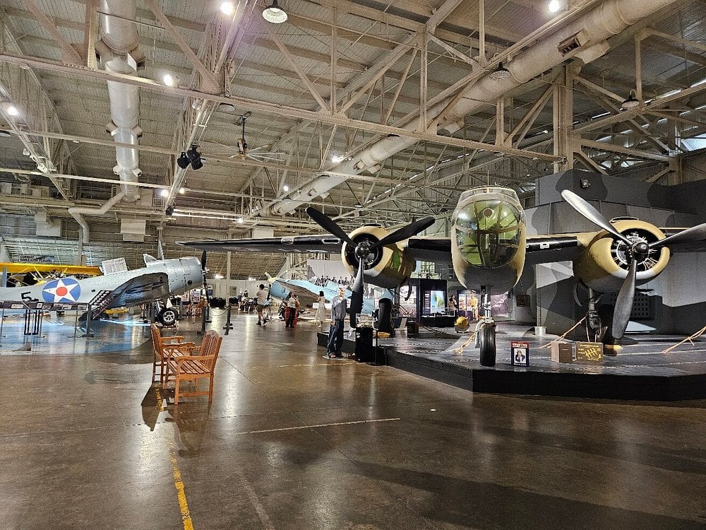 Exhibit of historic planes inside Pearl Harbor Aviation Museum hangar.