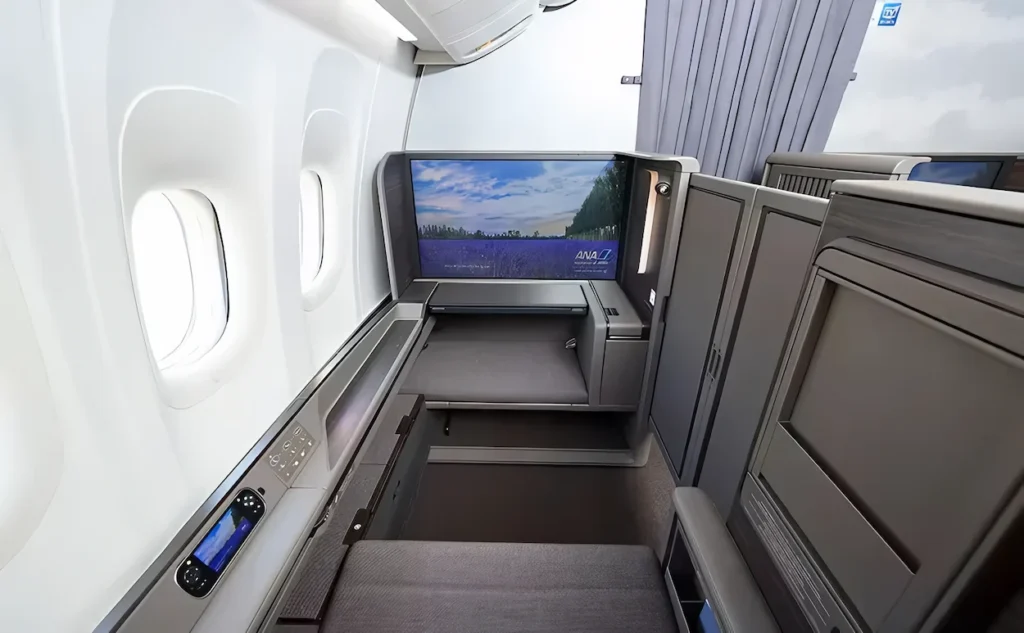 ANA First Class window suite with a large video screen