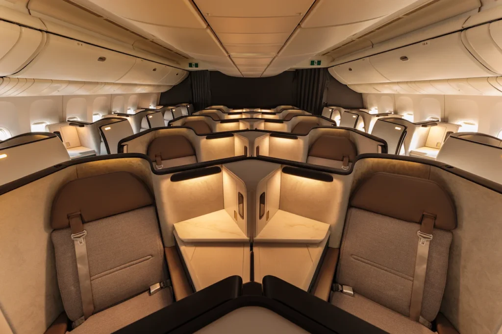 Aria Suite business class cabin with a spacious 1-2-1 layout and warm ambient lighting