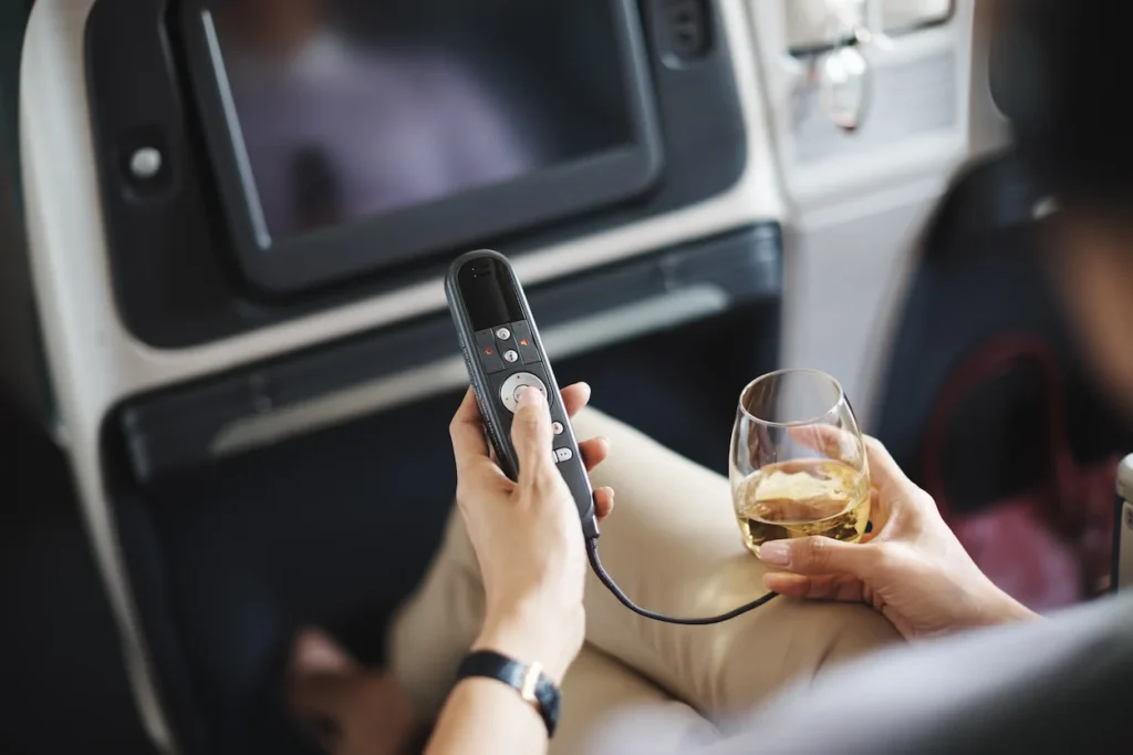 In-flight entertainment handset controller with attentive beverage service