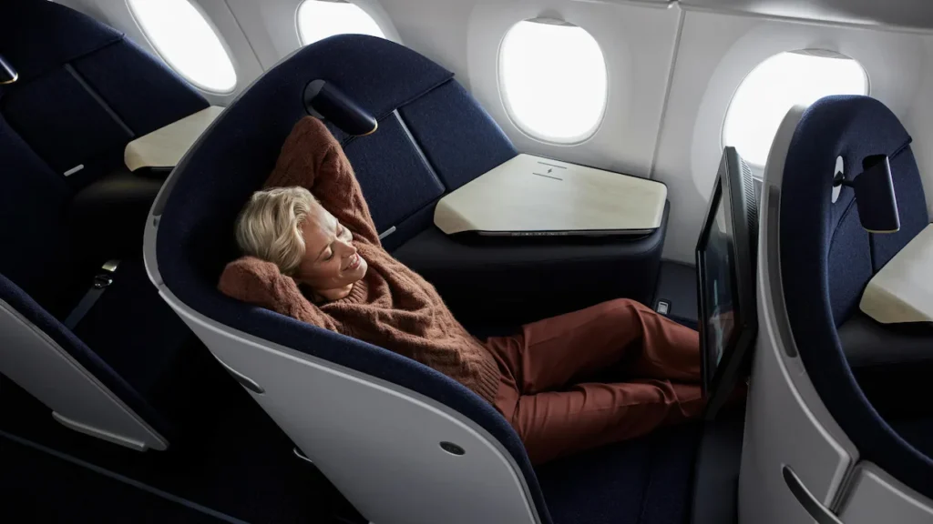 Passenger relaxes in Finnair’s innovative, non-reclining Collins Aerospace AirLounge business class seat