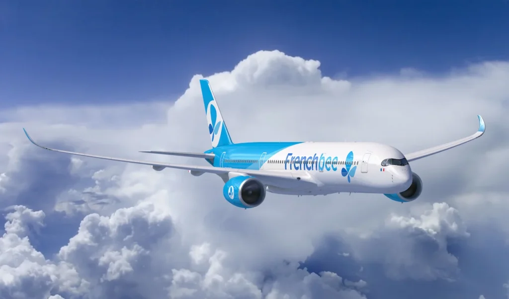 French Bee Airbus A350 airplane flying above white clouds