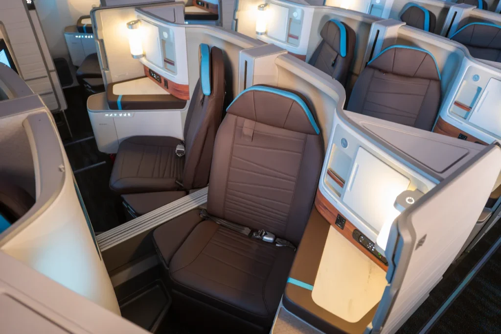 Hawaiian Airlines Boeing 787-9 Business Class cabin showing brown leather suites