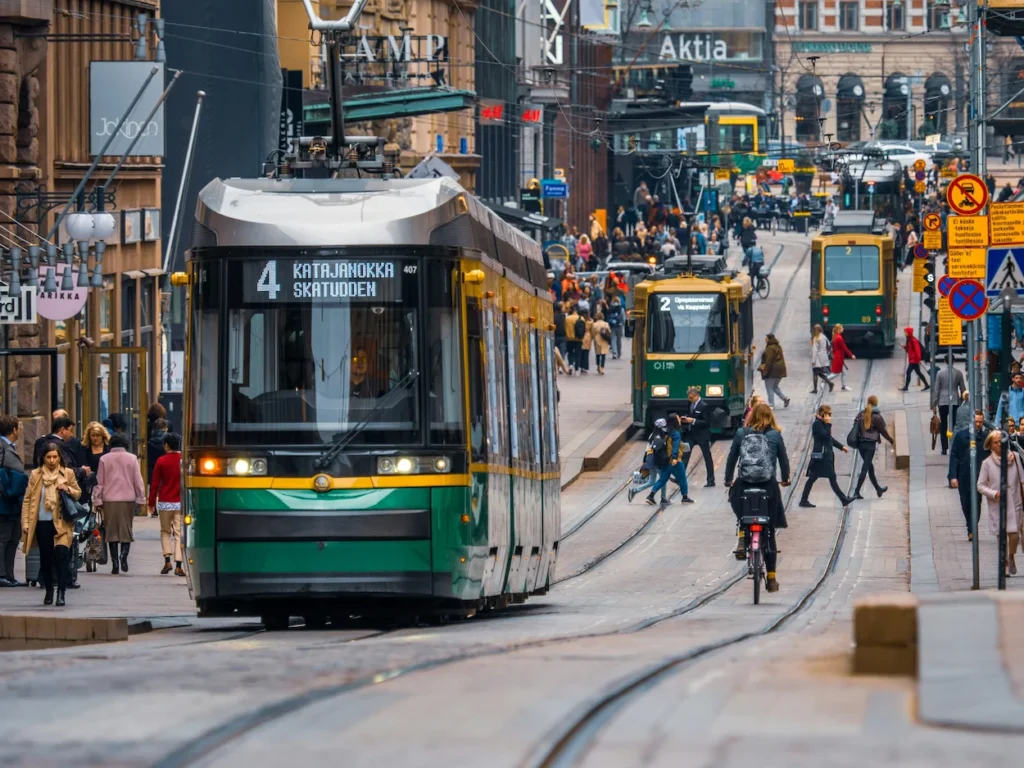 A green and yellow tram on Aleksanterinkatu street in Helsinki