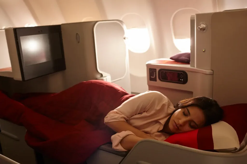 Fully lie-flat seats and premium bedding maximize rest inside Iberia business class