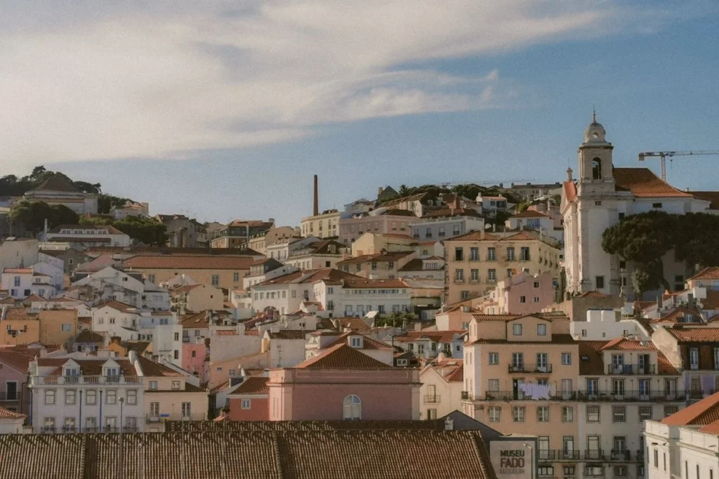 A hillside view of colorful houses in Lisbon's Alfama district featuring the Fado Museum