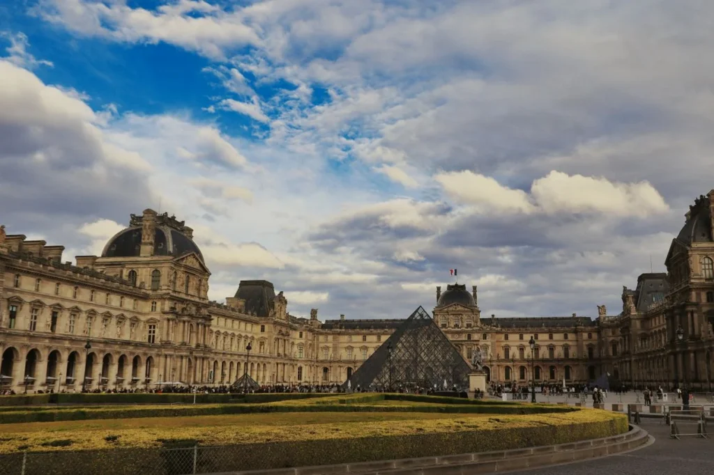 The glass Louvre Pyramid in front of the historic Louvre Museum museum palace in Paris